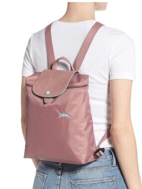 Pink Longchamp Le Pliage backpack with Blue Accents